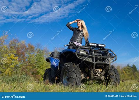 Elegant Blonde Woman Riding Extreme Quadrocycle Atv On Summer Field