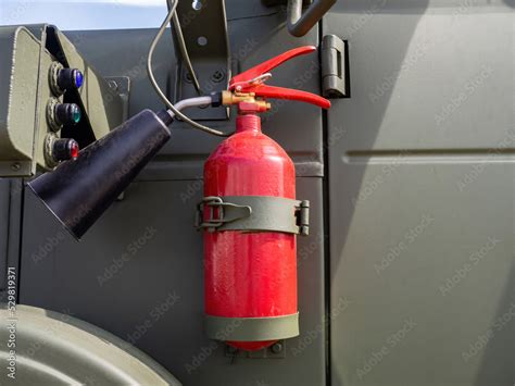 Fire extinguisher is fixed on car body. Flame extinguishing equipment ...