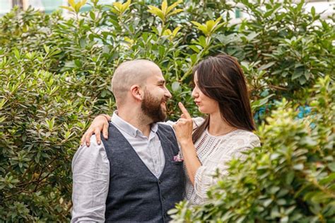 Premium Photo Beautiful Couple Girl And Guy In The Park Among Tropical Trees