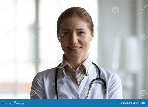 Portrait Of Smiling Female Doctor Posing In Hospital Stock Photo