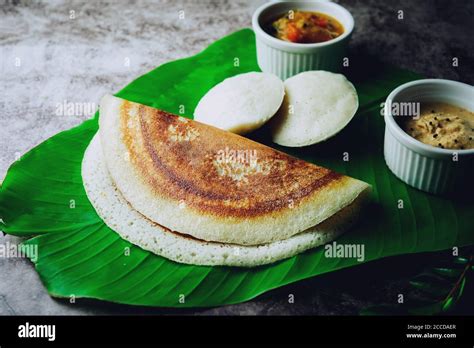 South Indian Breakfast Idli Dosa Sambar And Chutney Served In Banana