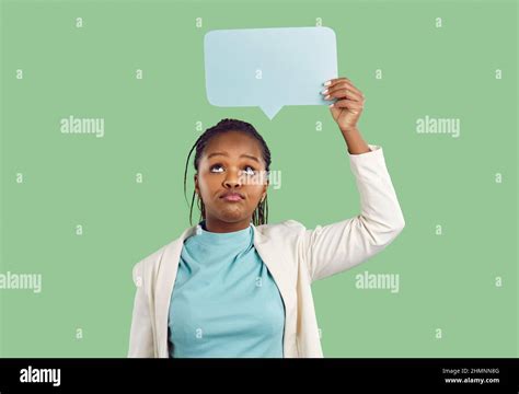 Skeptical unimpressed African American woman holding mockup bubble for ...