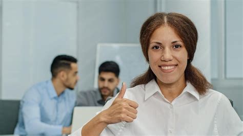 Premium Photo Smiling Friendly Businesswoman Looking At Camera