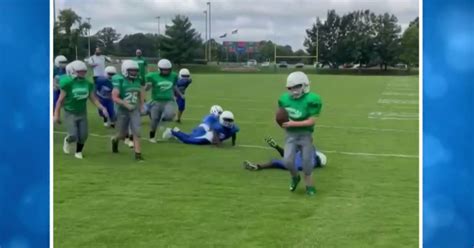 Elementary school football teams come together to set up special play ...