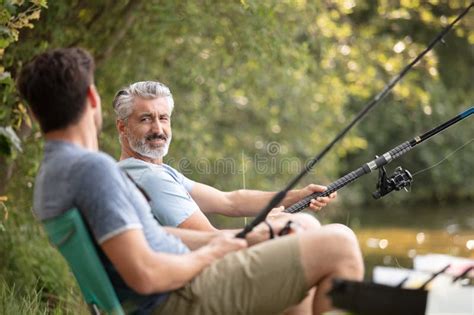 Mature Father With Adult Son Outdoors Fishing Stock Image Image Of Boots Together 281777063
