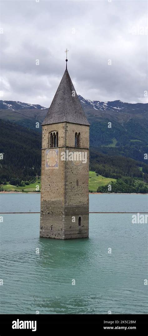 The Bell Tower Of Curon Submerged In Lake Resia In The Vinschgau Valley