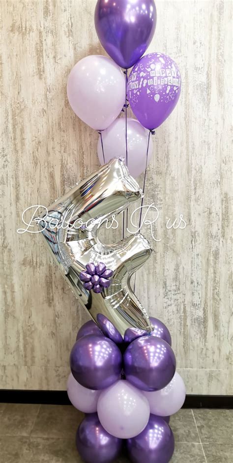 Letter Arrangement of chrome balloons - BALLOONS R US AMMAN