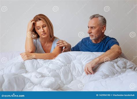 Loving Husband Supporting His Wife Having Problems At Work Stock Photo