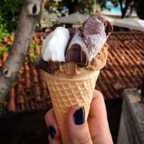 Woman S Hands Holding Melting Ice Cream Waffle Cone In Hands On Summer