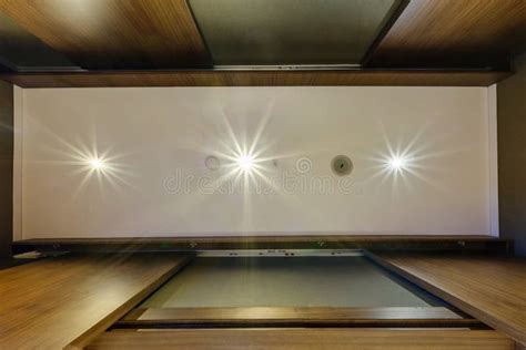 Look Up On Suspended Ceiling With Halogen Spots Lamps And Drywall