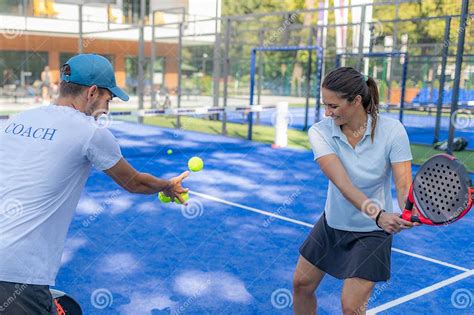 Padel Training Coach And Female Player Improving Techniques In A