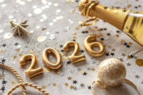 Golden 2026 new year numbers with confetti and champagne bottle Stock ...