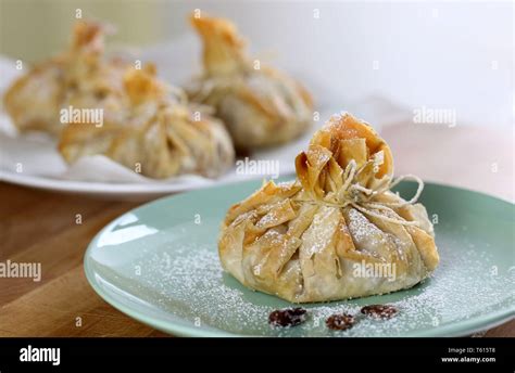 Phyllo Pastry Strudel With Apple Filling And Sultana Grapes Dusted