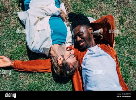 A Joyful Moment Shared Between A Gay Couple With An African American Man And His Partner