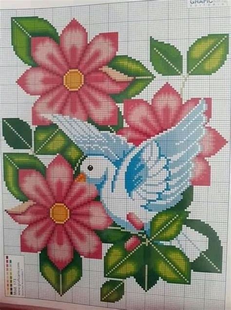 A Cross Stitch Pattern With Flowers And A Bird