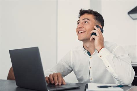 Premium Photo Smiling Businessman Wearing Glasses Talking On Phone