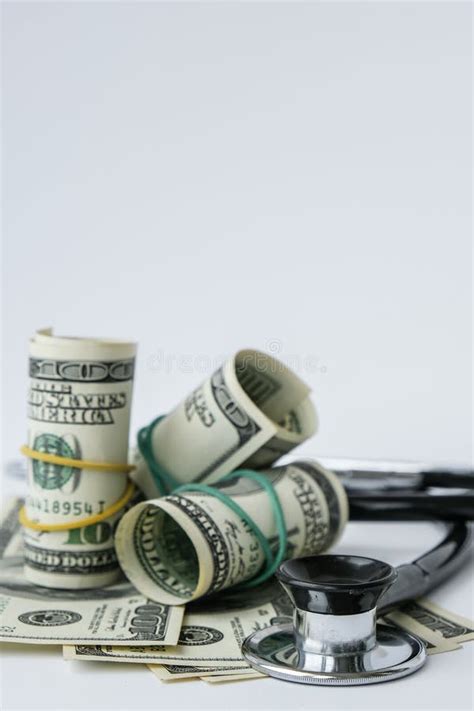 Stack Of Cash Dollars And Stethoscope The Concept Of Medical Expensive