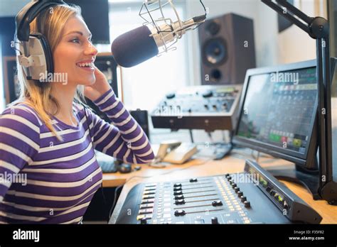 Happy Female Radio Host Broadcasting In Studio Stock Photo Alamy