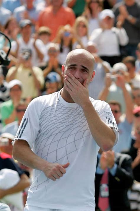 Download Andre Agassi In Action On The Tennis Court Wallpaper