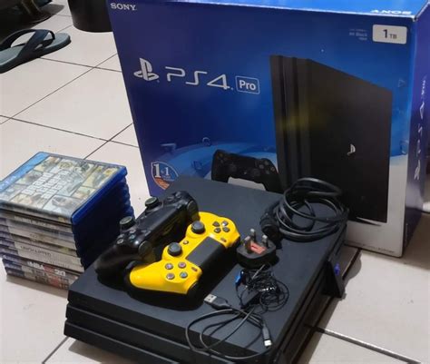 For Sale Ps4 Pro With 10 Physical Games And 2 Controllers Power Chord And Usb Charging Cable