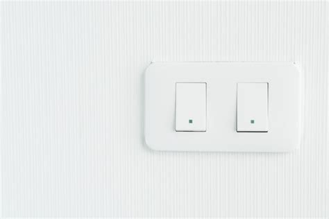 Premium Photo | Light switch on wall