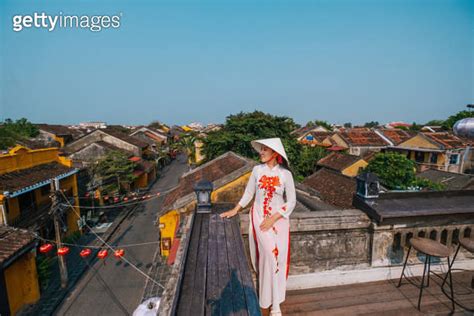 Asian Woman Wearing Vietnam Traditional Culture Walking Around At Hoi