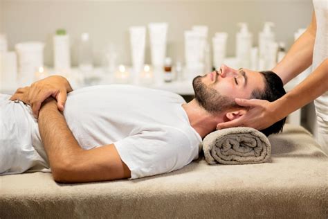 Premium Photo Man Enjoying Neck Massage In Spa Salon