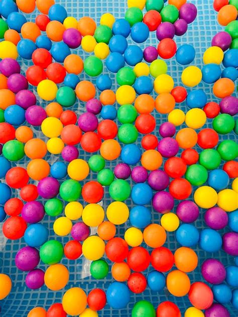 Colorful Plastic Balls Floating In The Water · Free Stock Photo