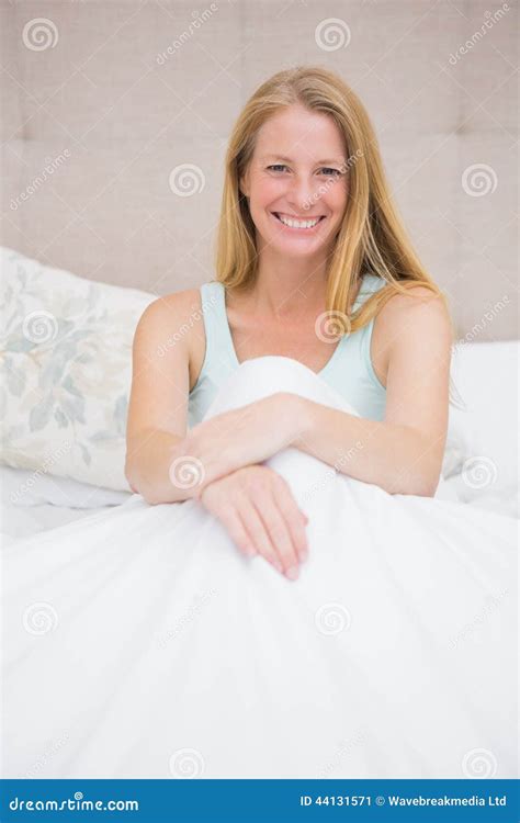 Happy Blonde Smiling At Camera On Her Bed Stock Image Image Of Male Nightwear