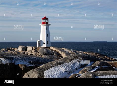 Snow By Peggys Point Lighthouse At Peggys Cove In Nova Scotia Canada The Octagonal Lighthouse