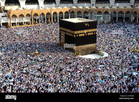 Holy Kaaba. Crowd of muslims walking around Kaaba for Tawaf during Hajj ...