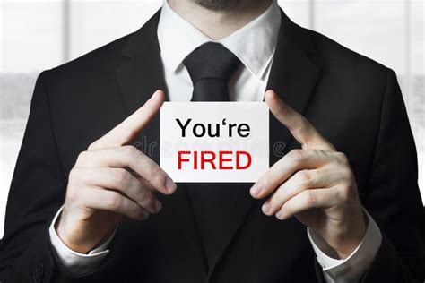 Businessman Holding Sign You are Fired Stock Image - Image of message ...