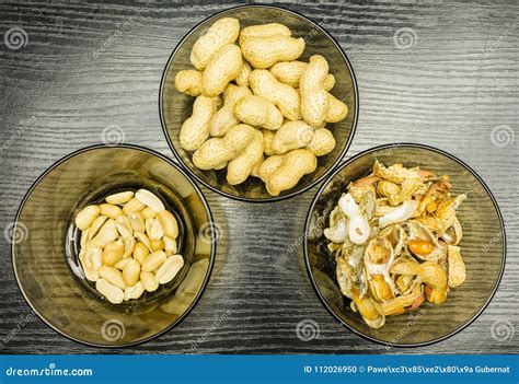 Peeling Peanuts. a Bowl of Peels and Clean Peanuts on the Plate. View ...