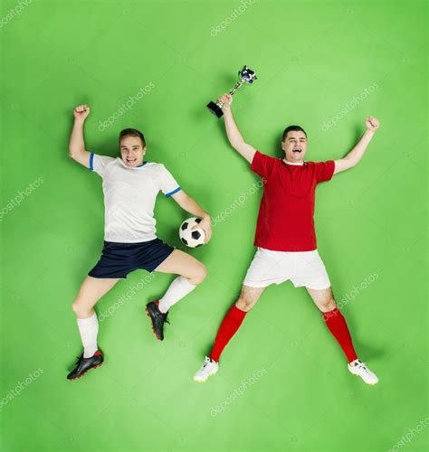 Football players celebrating victory. Stock Photo by ©halfpoint 60117351