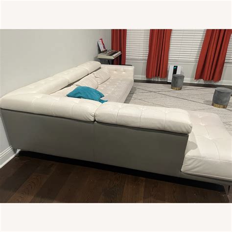 Rooms To Go White Faux Leather Sectional - AptDeco