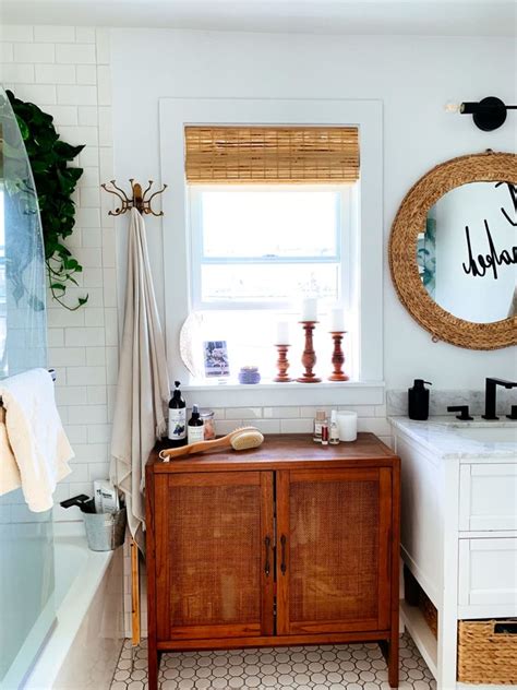 A Bathroom With A Sink Mirror And Bathtub