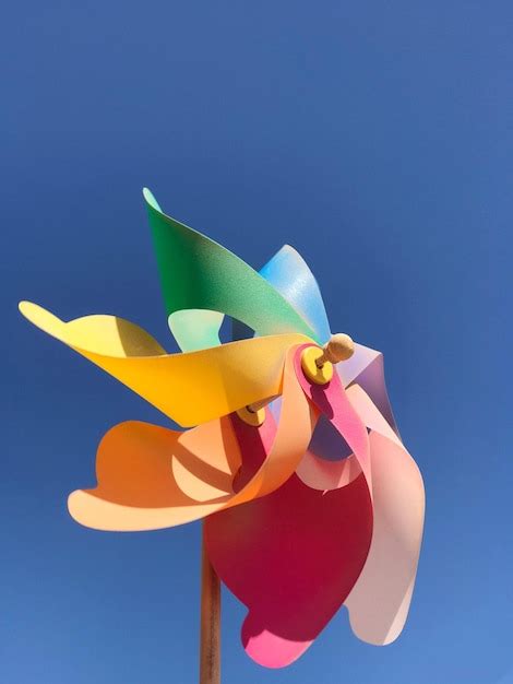 Premium Photo Low Angle View Of Multi Colored Pinwheel Toy Against