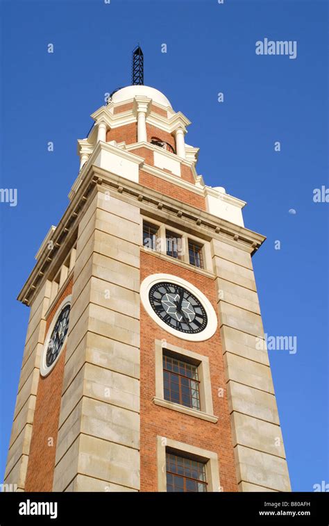 Looking Up At The Old Kowloon Railway Station Clock Tower In Hong Kong