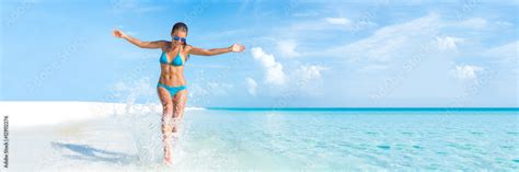 Sexy Bikini Body Woman Playful On Paradise Tropical Beach Having Fun Playing Splashing Water In
