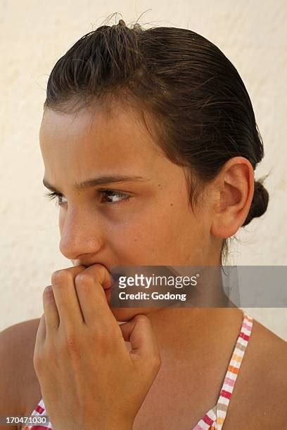 Girl Biting Nails Photos And Premium High Res Pictures Getty Images