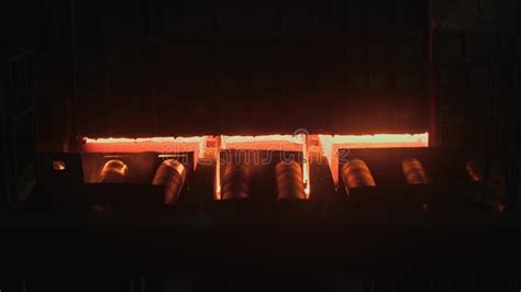 A Red Hot Sheet Of Metal Rolls Down A Conveyor At A Steel Production Plant Stock Footage