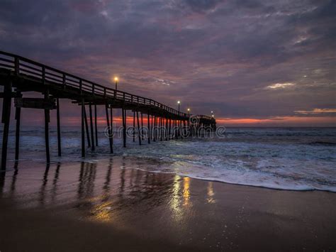 Sunrise Over Fishing Pier At North Carolina Outer Banks Stock Photo