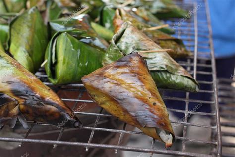 Sticky rice wrapped in banana leaves grill Stock Photo by ©luknaja 62021457