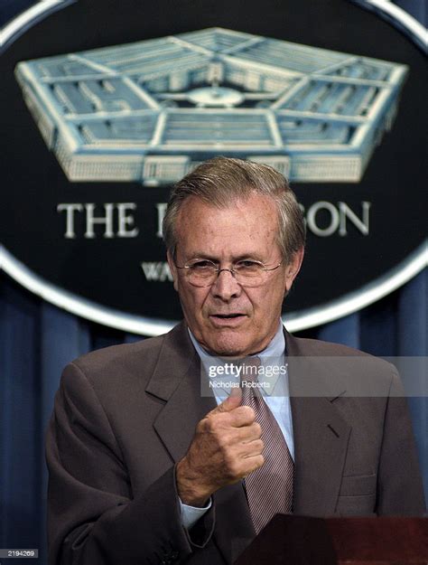 U S Defense Secretary Donald Rumsfeld Points During A News News