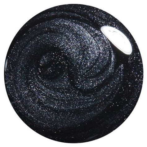 A Black And White Circular Object With Some Glitter On The Top In