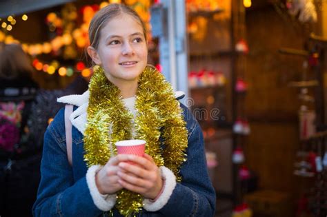 Teenagers Girl Holding Hot Cup Of Coffee In Hands At Street Christmas Fair Stock Image Image