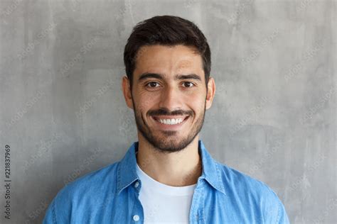 Indoor Photo Of Handsome European Guy Pictured Isolated On Grey