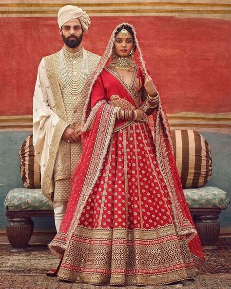 Couple Wedding Outfits By Sabyasachi Sabyasachi Bridal Red Bridal Lehenga Red Latest Bridal