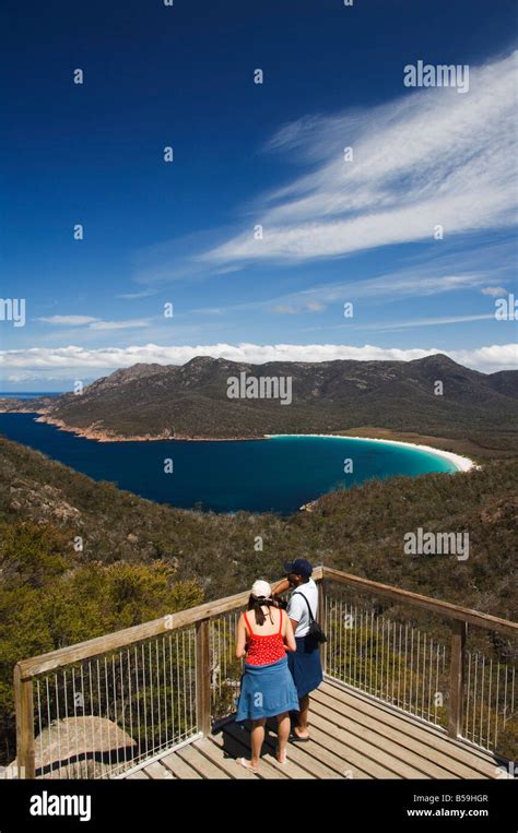 Tourists Admiring The View Of Wineglass Bay Coles Bay Freycinet Peninsula Freycinet National