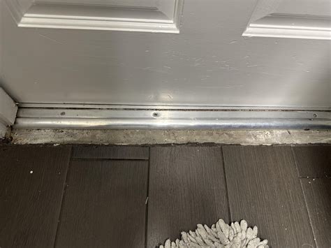 Changed out old rotting wood door threshold for aluminum one (widest